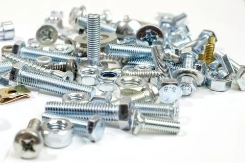 Bolts, nuts and screws. Pattern of nuts and bolts. There is a place for your  Stock Photos
