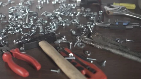 Bolts nuts screws, hand tools on the table Video stock 101228446