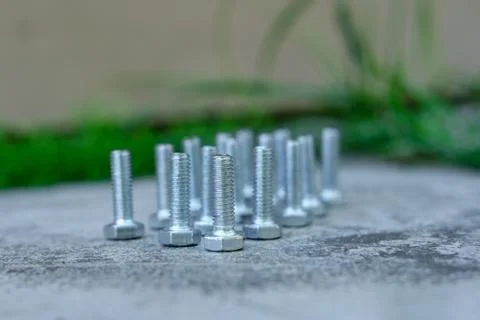 Bolts stand head down. Stock Photos