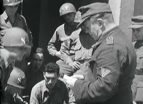 BOLZANO - 1945: Document check - German soldier presents a paper to guards Stock Footage 343848958