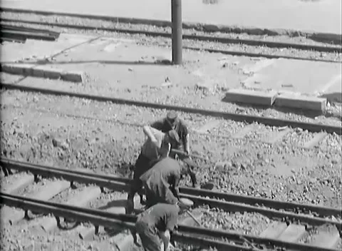 BOLZANO - 1945: Rail alignment - Track crew levers a rail into position Stock Footage 343848918