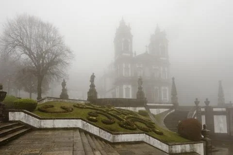 Bom Jesus do Monte Sanctuary in Braga, Portugal, surrounded by dense fog, f.. Stock Photos
