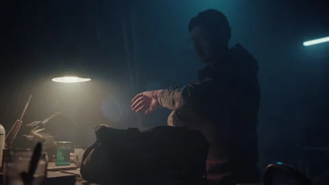 Bomb maker checking the time Stock Footage 256016878