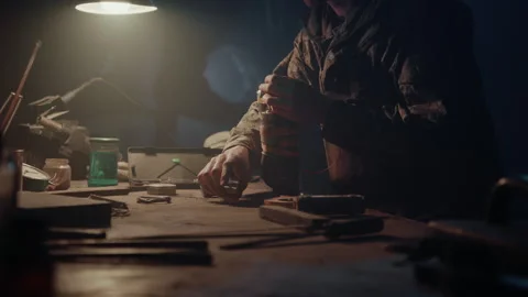 Bomb maker creating an explosive in the warehouse Video stock 256017605