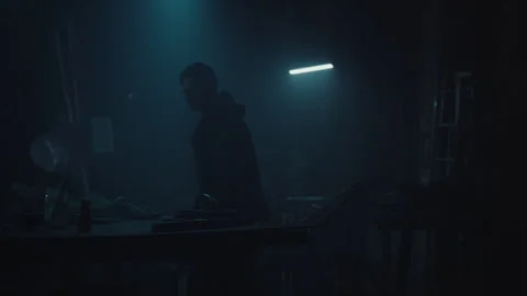 Bomb maker preparing the table Stock Footage 256028179