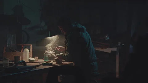 Bomb maker soldering a device Stock-Footage 259904769