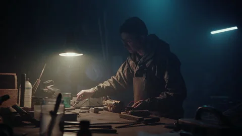 Bomb maker soldering an explosive Stock-Footage 256016350