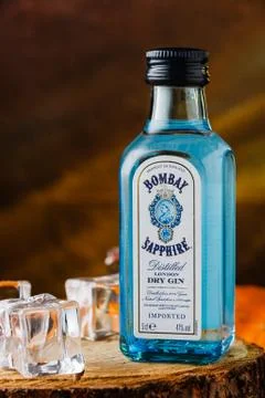 Bombay sapphire gin bottle on black and orange background Stock Photos