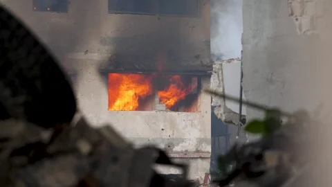 Bombed building massive fire burning after missile attack explosion during Stock Footage 275840719