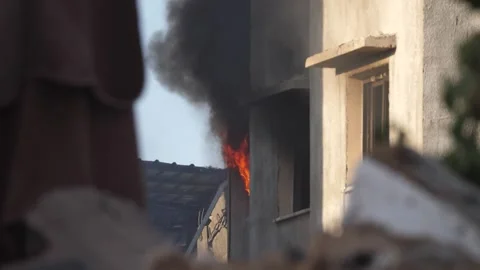 Bombed building massive fire smoke after missile attack explosion when Stock Footage 275837410