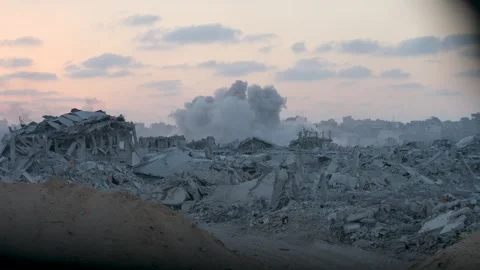 Bombed buildings and large cloud after explosion in destroyed Gaza, war footage Stock Footage 321703332