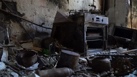 Bombed kitchen and things close-up. Consequences fire after a russian shellings Stockbeeldmateriaal 221256732