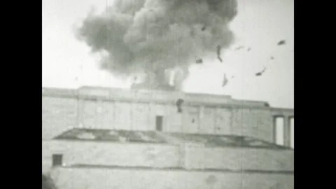 Bombing exploding over building during world war ii Stock Footage 314055262