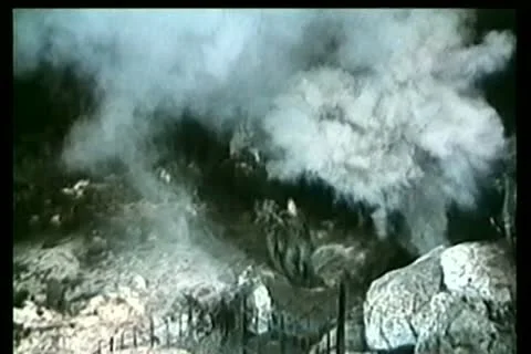 Bombs exploding around soldiers in cave Stock Footage 11345949