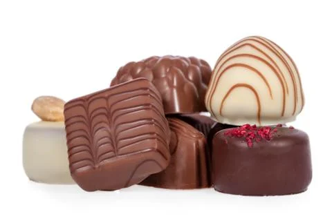 Bonbons, aka bon-bons and truffles made of dark, white and milk chocolate Stock Photos