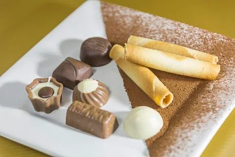 Bonbons on plate Stock Photos