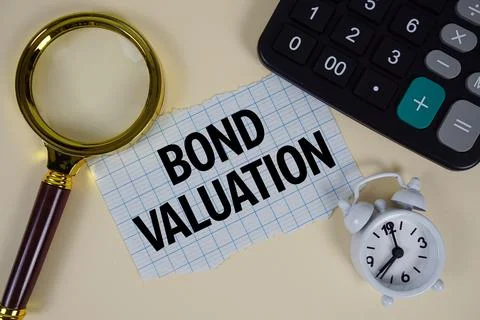 Bond Valuation text with alarm clock, magnifying glass anc calculator on ye.. Stock Photos