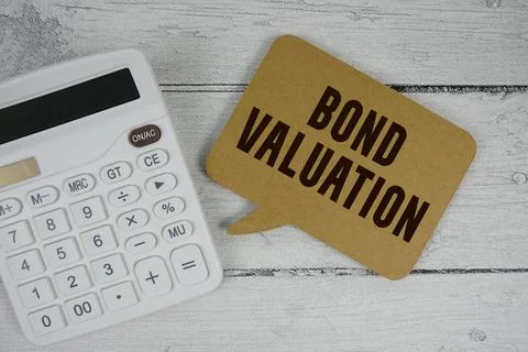 Bond Valuation text with calculator on wooden background Stock Photos