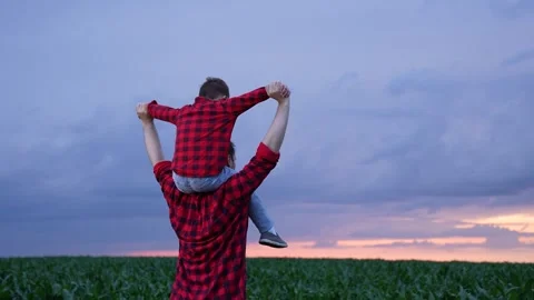 Bonding between generations, relaxing time, open sky and farmland, Hands held Stock Footage 314683797