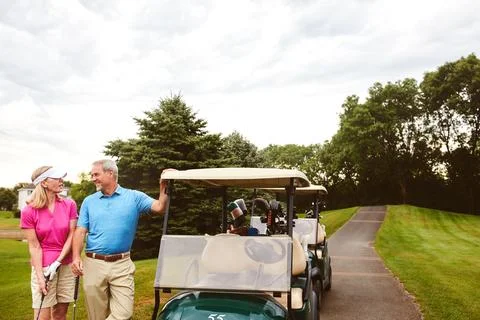Bonding on the golf course. an affectionate mature couple spending a day on the Fotos de archivo