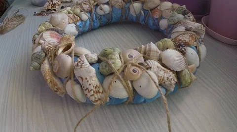 Bonding seashells on decorative wreath Stock Footage 58750475