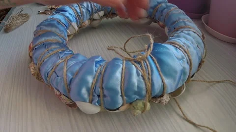 Bonding seashells on decorative wreath Stock Footage 58750892