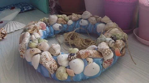 Bonding seashells on decorative wreath. Hand made Stock Footage 58748419