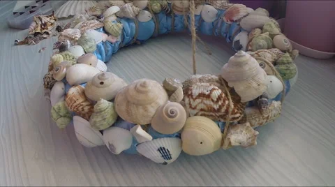 Bonding seashells on decorative wreath. Hand made Stock Footage 58751274