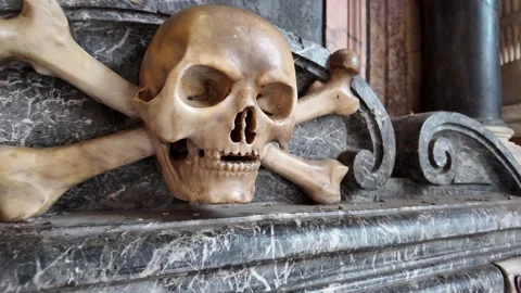 Bone and skull sculpture inside a historic church Видео 320957191