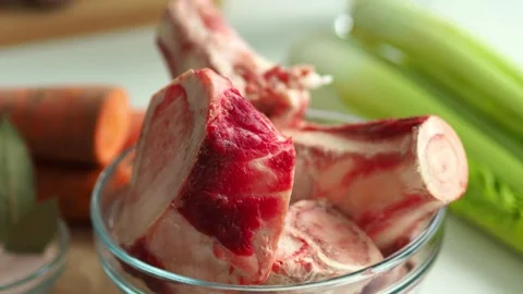 Bone broth. The cooking process and ingredients. Raw beef bones. Bones contain c Video stock 297770183