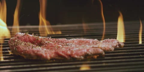 Bone steak cooking on grill Vídeo Stock 247385447