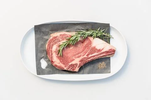 Bone in steak with rosemary Stock Photos