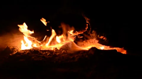 Bonfire, against the background of the noise of the sea. Stock Footage
