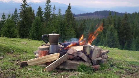 Bonfire and coffee maker in the mountains Stock Footage 142204738