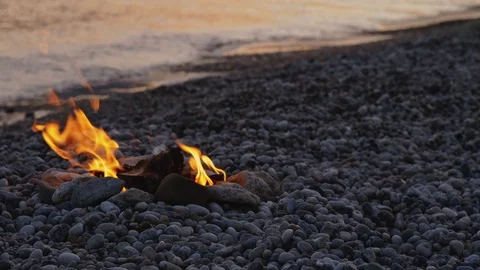 Bonfire on the beach in the background of the surf Stock Footage 126024860