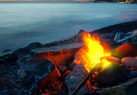 Bonfire on the beach, sunset Stock Photos