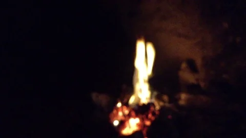Bonfire burning in the dark cave 2 Stock Footage 73678893