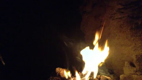 Bonfire burning in the dark cave 3 Stock Footage 73678943