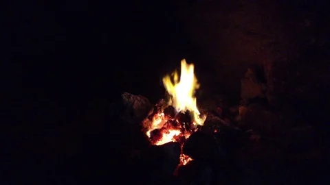Bonfire burning in the dark cave Stock Footage 73678888