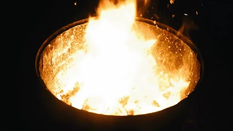 A bonfire is burning in a metal barrel Stock Footage 339304537