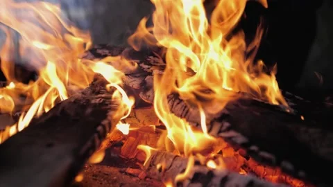 A bonfire burns. Close-up of flames. Summer evening. Slow motion Stock Footage 130730938