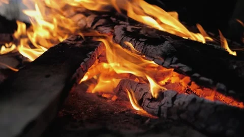 A bonfire burns. Close-up of flames. Summer evening. Slow motion Stock Footage 130731140