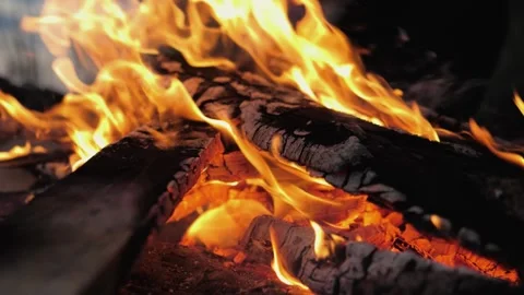 A bonfire burns. Close-up of flames. Summer evening. Slow motion Stock Footage 130731617