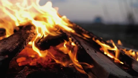 A bonfire burns. Close-up of flames. Summer evening. Slow motion Stock Footage 130731753