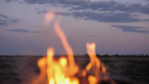 A bonfire burns. Close-up of flames. Summer evening. Slow motion Stock Footage 130735134