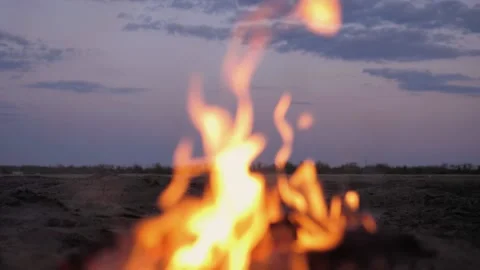 A bonfire burns. Close-up of flames. Summer evening. Slow motion Stock Footage 130735328