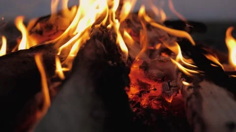 A bonfire burns. Close-up of flames. Summer evening. Slow motion Stock Footage 130735546