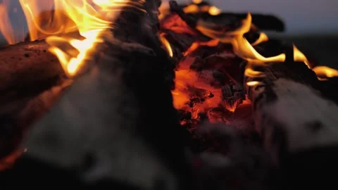 A bonfire burns. Close-up of flames. Summer evening. Slow motion Stock Footage 130735836