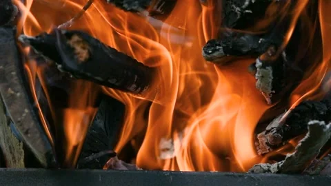 A bonfire burns. Close-up of flames. Summer evening. Slow motion. Close up .. Stock Footage 274186290