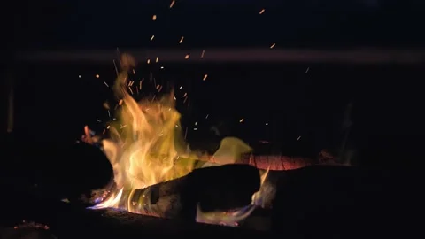 A bonfire burns on the seashore at sunset. Stock Footage 134894827
